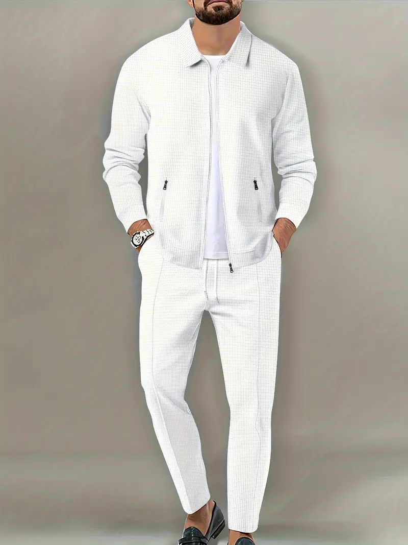 a man in a white suit and a white shirt