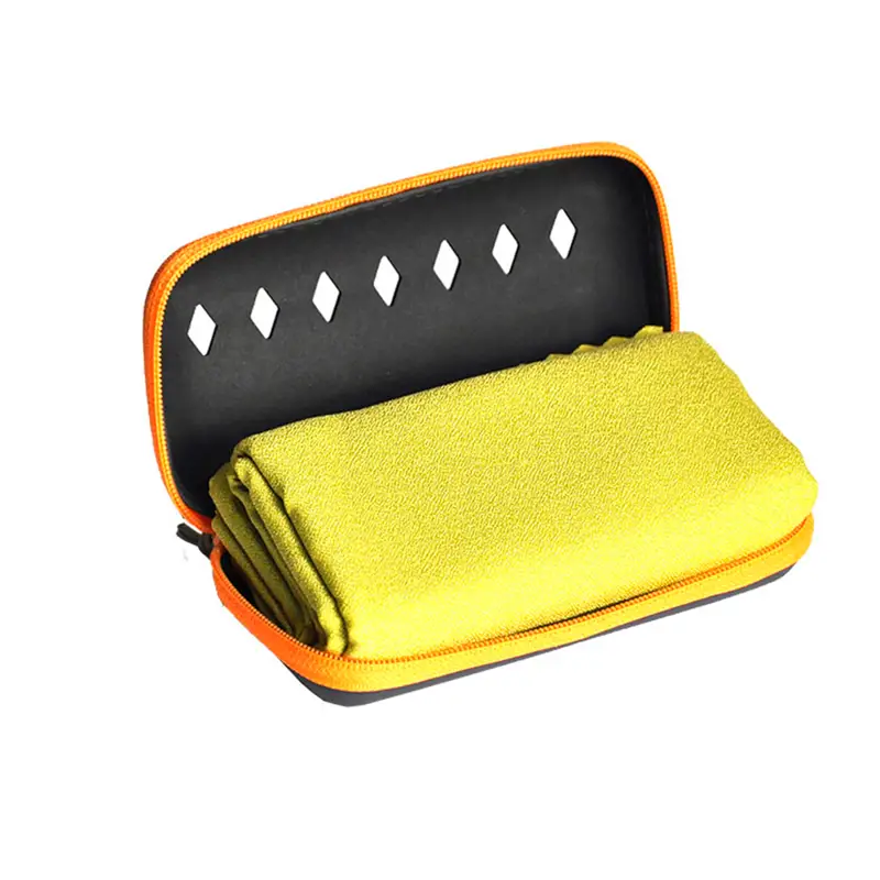 a yellow case with a towel and a towel