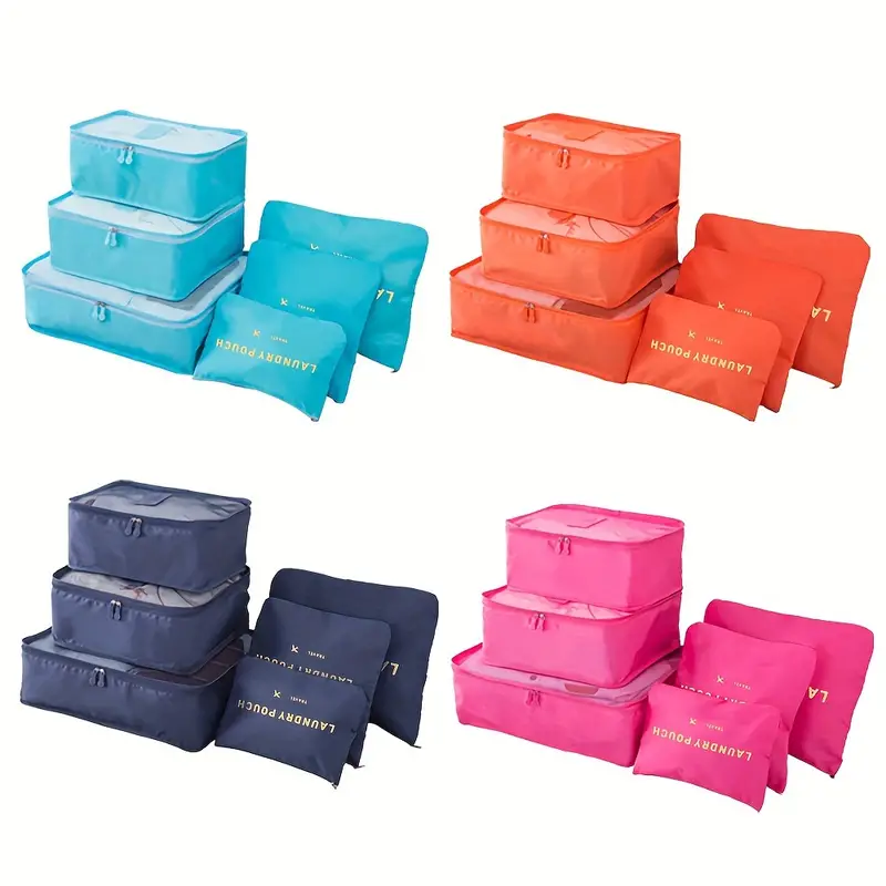 a set of six packing cubes with a variety of items