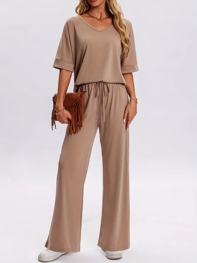a woman in a brown top and pants
